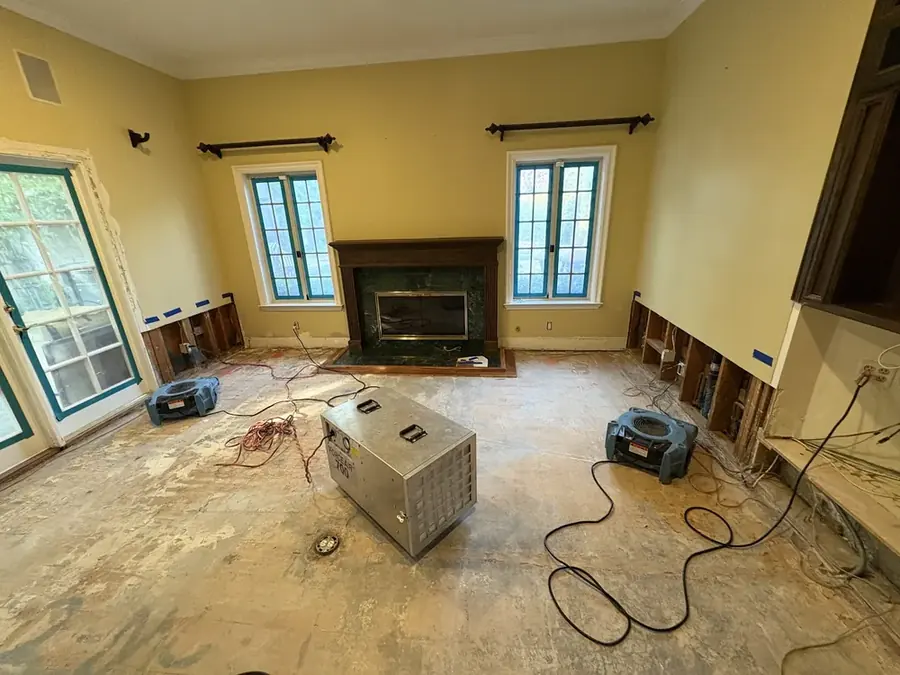 A dehumidifier drying a flood-cut room in a Bronx, NY building