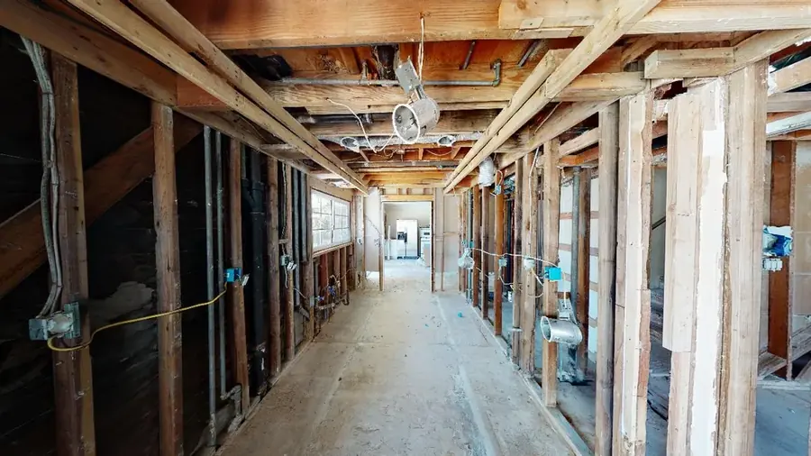 Top-floor Bronx, NY apartment opened and dried after a flat roof and parapet leak