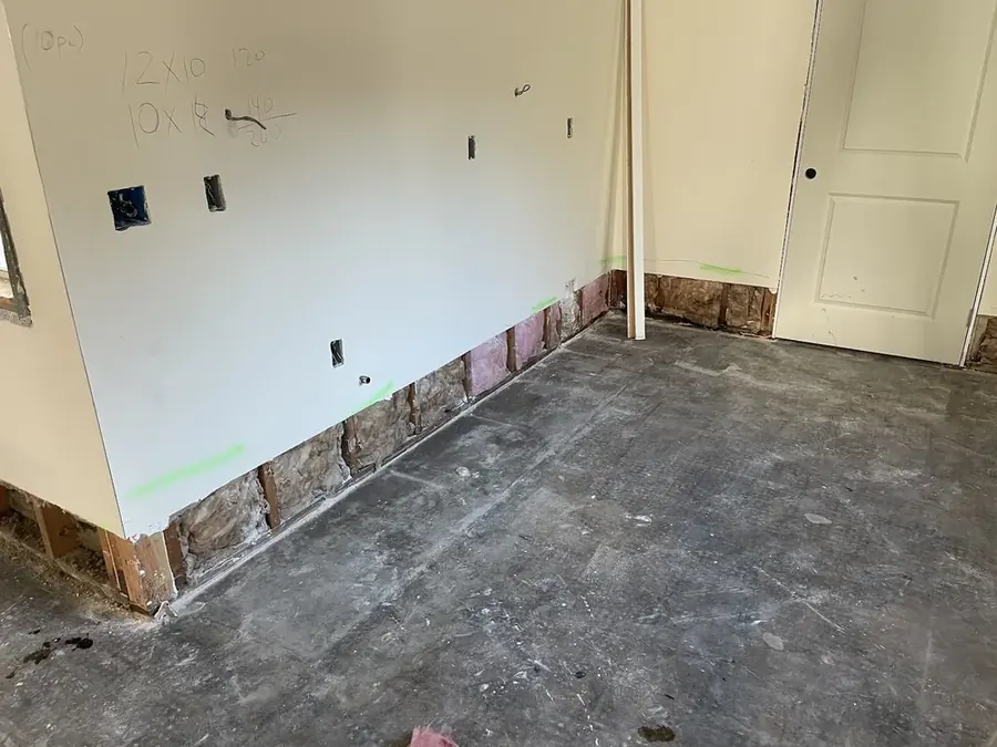 Flood-cut walls opened to dry after storm flooding in a Bronx, NY building